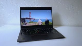 The Lenovo ThinkPad T14s Gen 6 on a white table showing a scene from Netflix's "Man On the Inside"