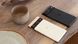 image of two Google Pixel 6 phones on a wooden desk