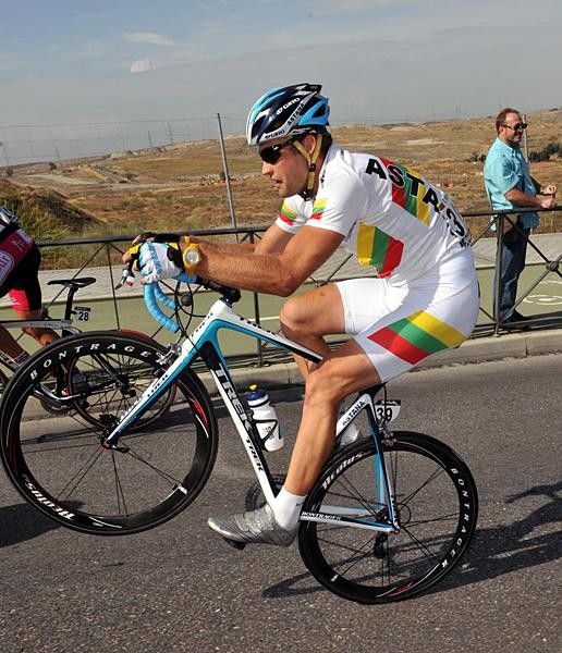 Tomas Vaitkus (Astana) heads out of the Vuelta a Espa&ntilde;a on one wheel.