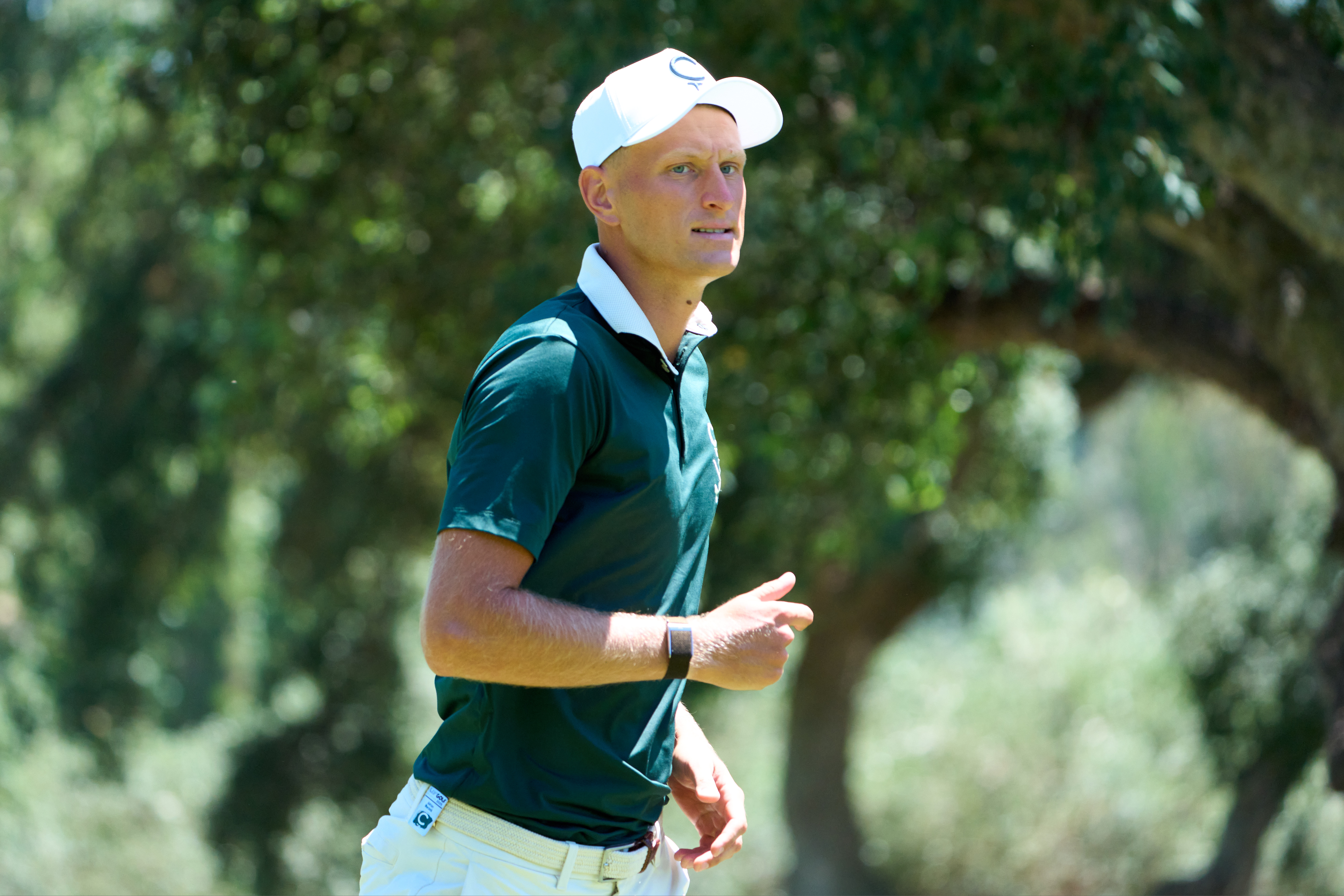 Adrian Meronk walks off the green