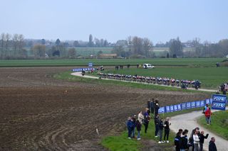 A general view of the peloton passing through the Orchies cobblestones sector during Paris-Roubaix Femmes