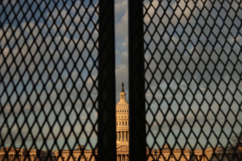 The Capitol behind fences.