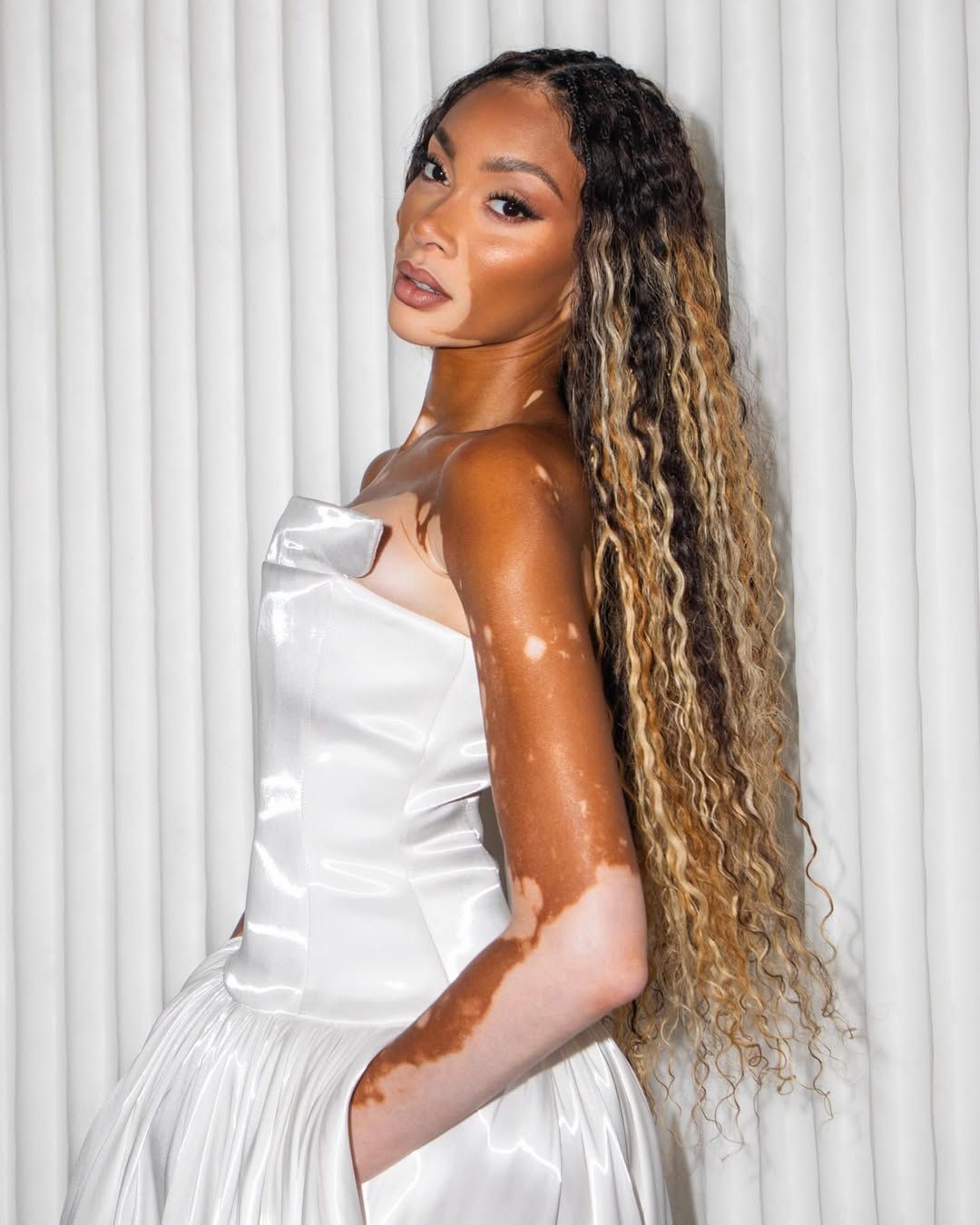Winnie Harlow with ash brown goddess braids