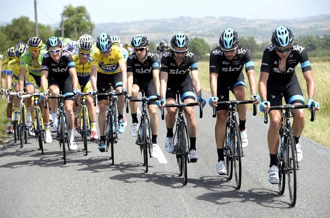 Team Sky works for their overall race leader Chris Froome during the second stage
