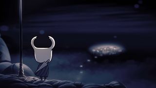 A screenshot of the Knight looking over the main city of Hollow Knight