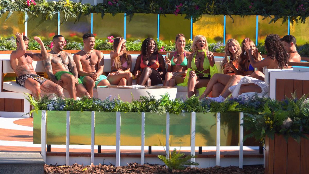 The original 12 islanders sitting together in Love Island: All Stars