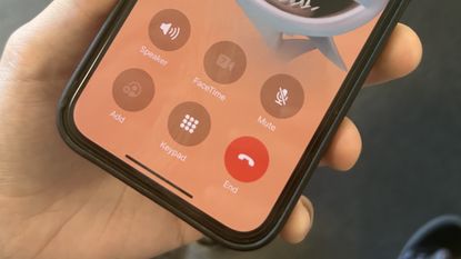 The iPhone 13 running iOS 17, showing the changed position of the call button