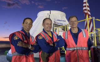 NASA astronauts Nicole Mann (left) and Mike Fincke (center) and Boeing astronaut Chris Ferguson (right) pose for a photo on Sept. 11, 2019, as they rehearse landing and crew extraction from Boeing's CST-100 Starliner.