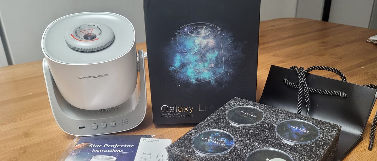 The Orzorz Galaxy Lite Home Planetarium Star Projector with accessories