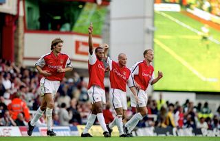 Arsenal v Manchester United - Thierry Henry of Arsenal celebrates scoring the only goal of the match with Tony Adams, Fredrik Ljungberg and Dennis Bergkamp. (Photo by Mark Leech/Offside via Getty Images)