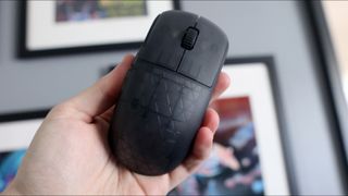 An Endgame Gear OP1w 4K gaming mouse on a desk.