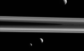 Three of Saturn's moons — Tethys, Enceladus and Mimas — appear in this group photo from NASA's Cassini spacecraft, taken on Dec. 3, 2015.