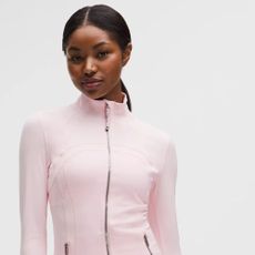 Young woman wearing light pink Define Jacket from Lululemon