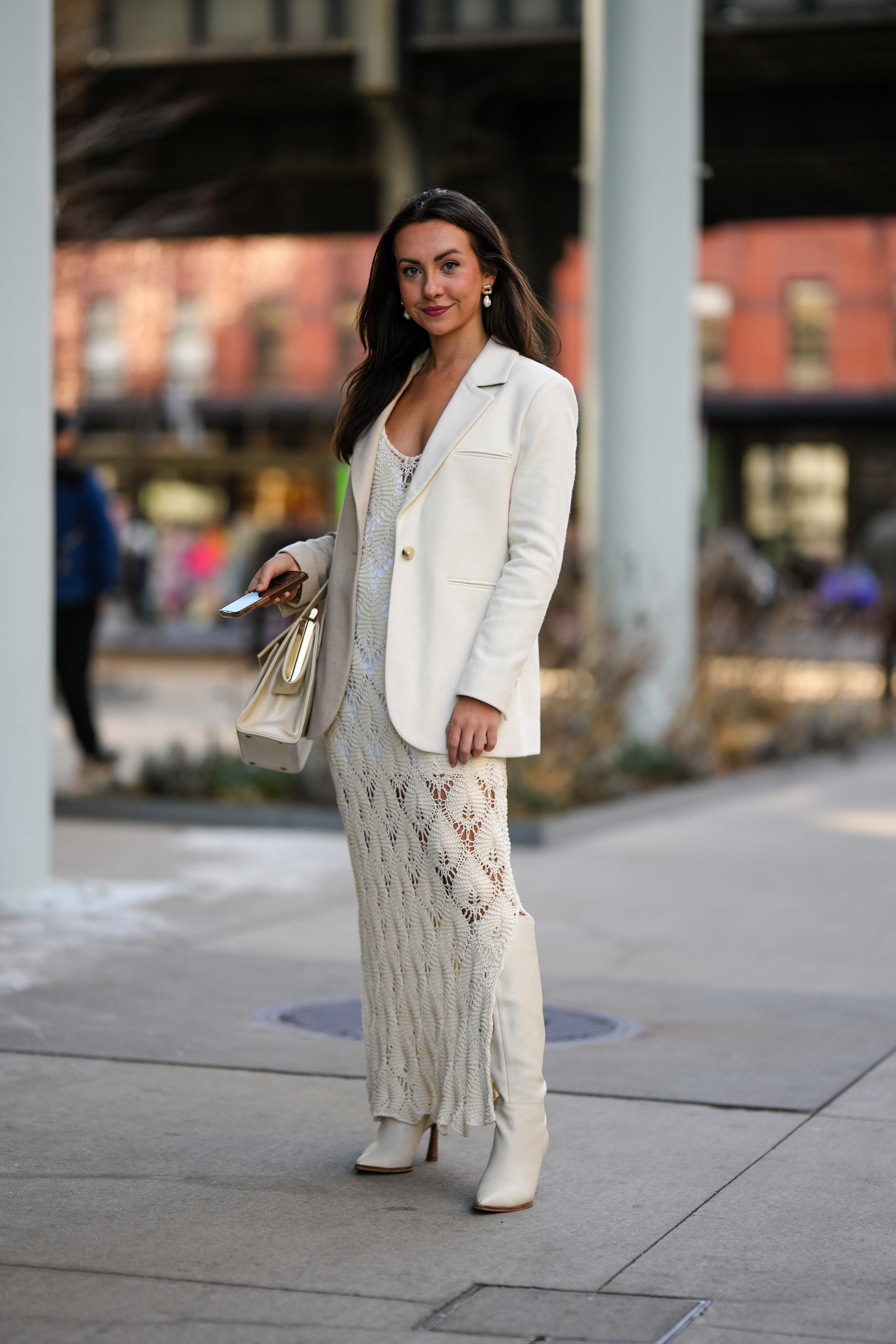 kendall wears white crochet dress, white boots and a white blazer