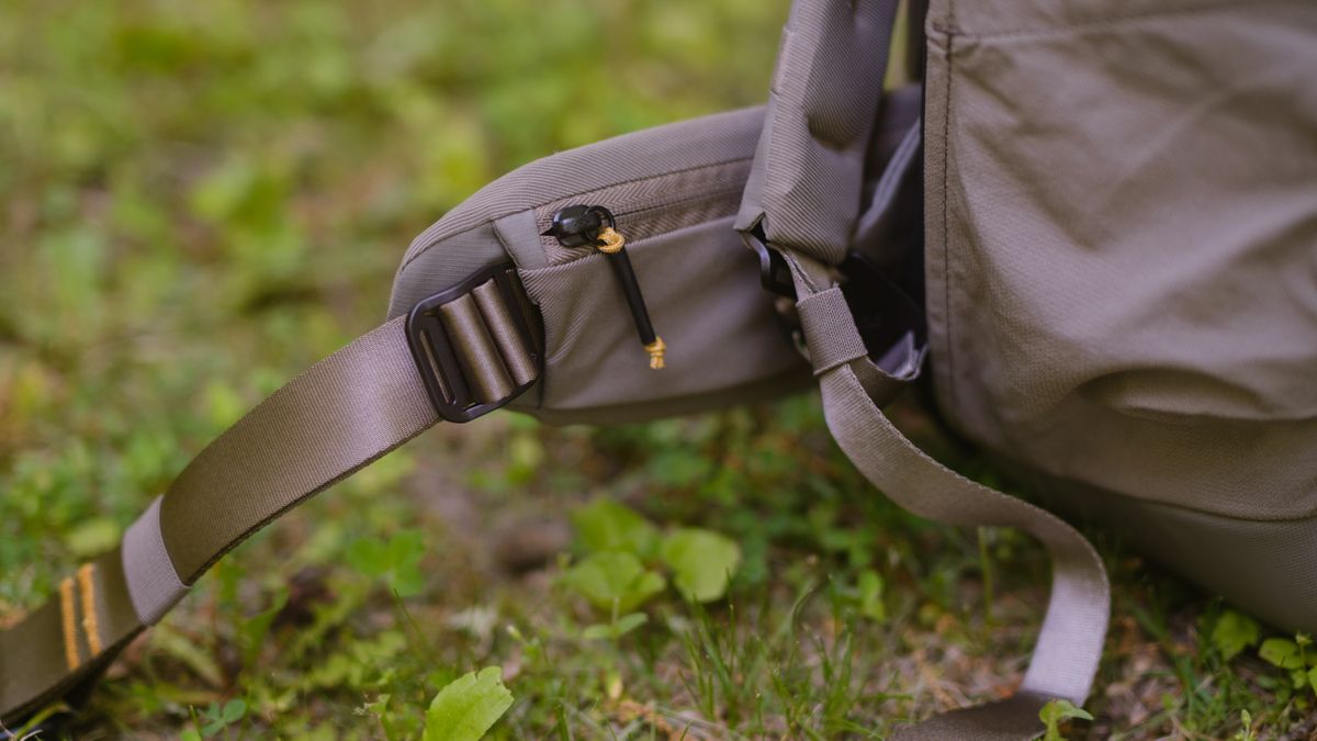 The Peak Design Travel 2-in-1 Backpack outdoors used by a photographer