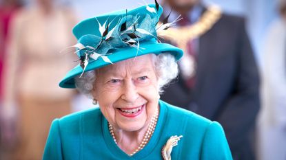 Queen Elizabeth II smiles during a visit to the Edinburgh Climate Change Institute