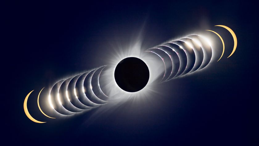A compilation of eclipse images making a time lapse photo showing a dark dot in the center for a full totality solar eclipse