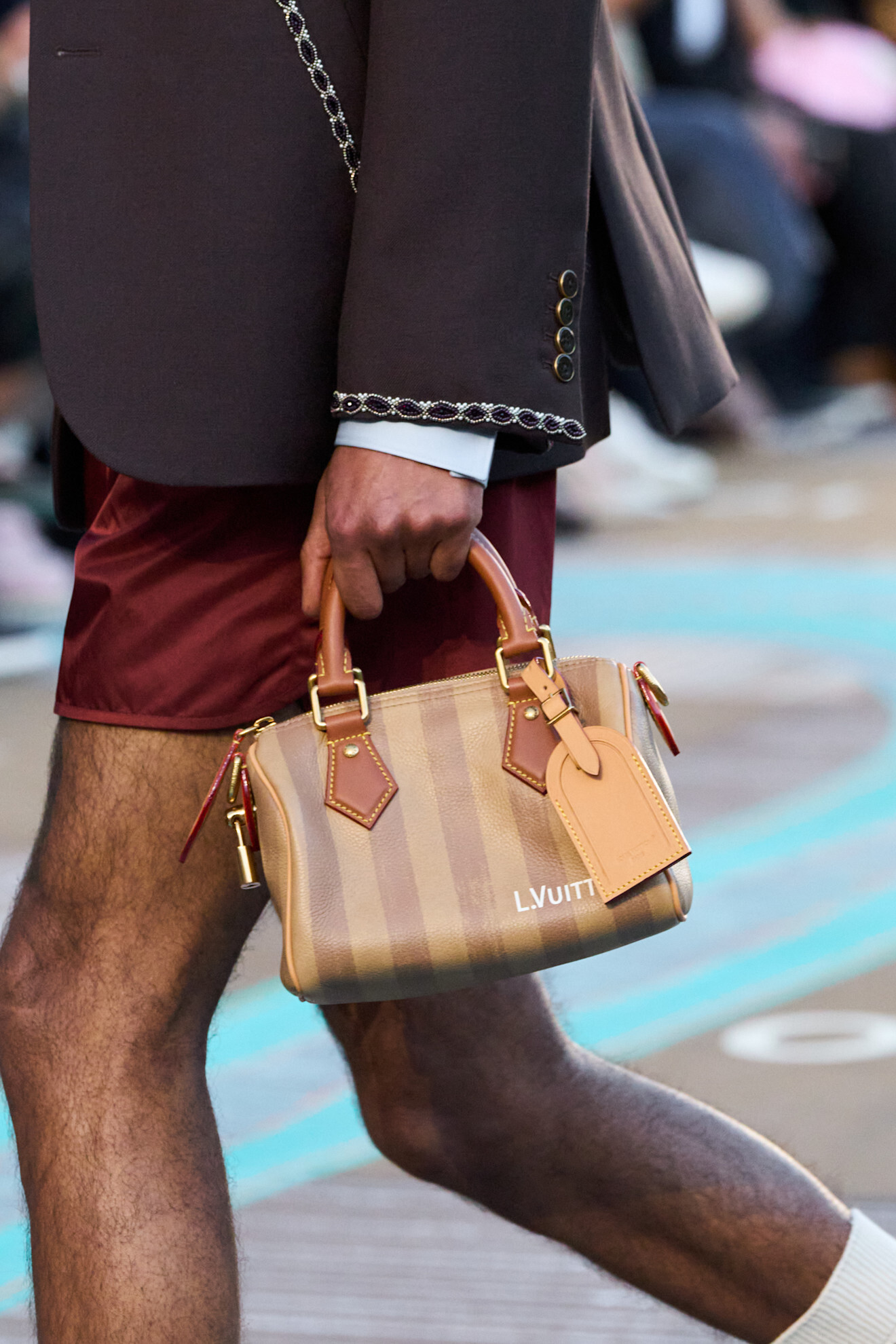 A model wears the Beyoncé-approved duffle bag on the Louis Vuitton Spring/Summer 2026 runway.
