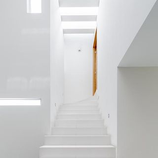 White staircase with white walls