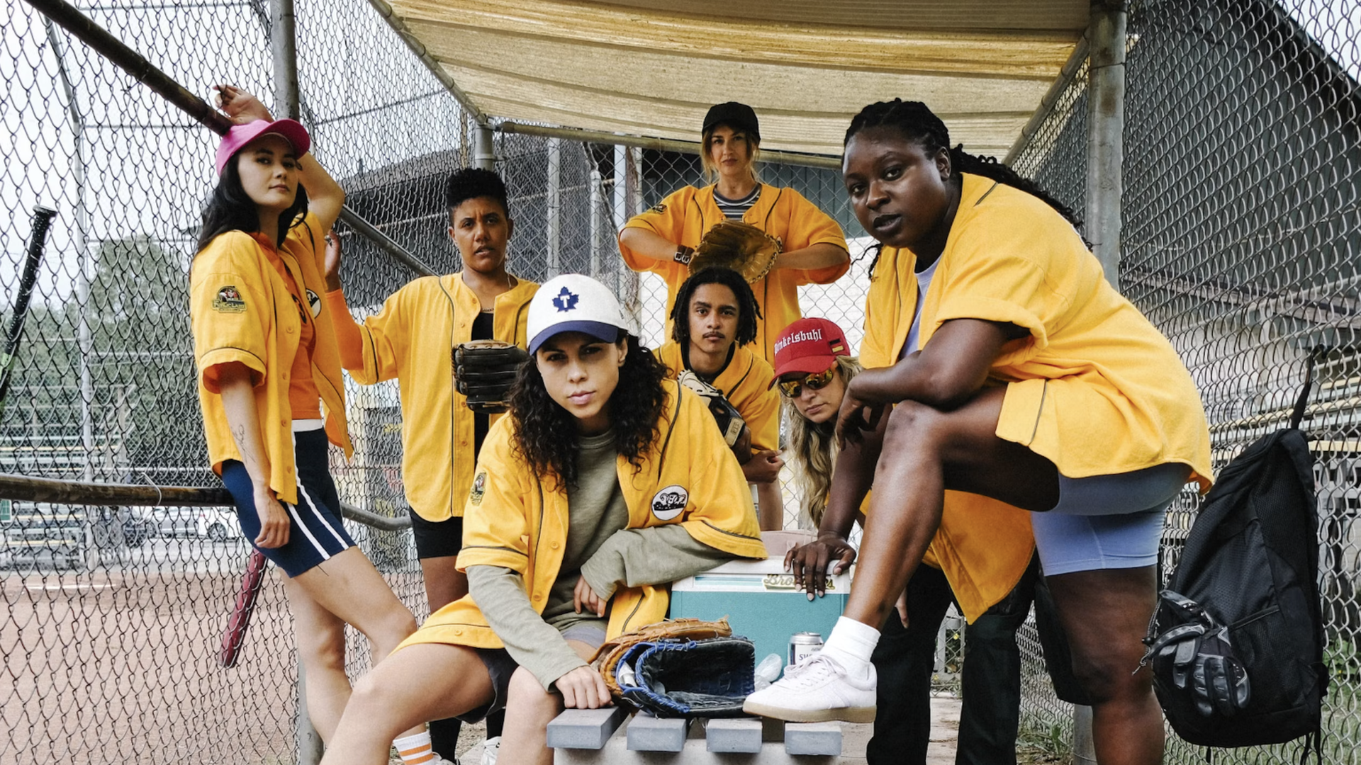 The cast of Slo Pitch, led by Jess Salgueiro as Joanne Pico