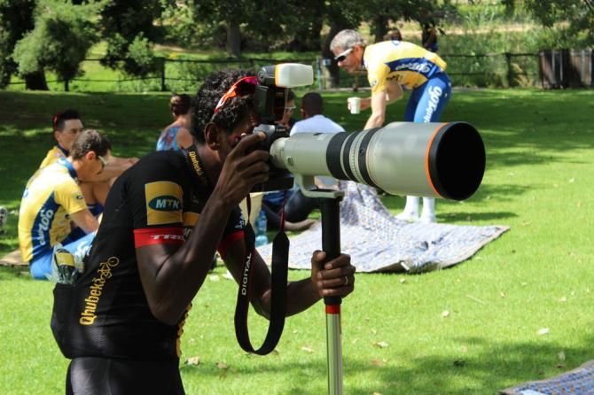 Daniel Teklehaimanot takes some photos of his teammates.