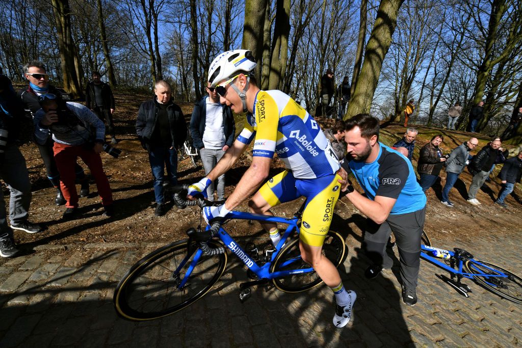 KOKSIJDE BELGIUM MARCH 18 Lindsay De Vylder of Belgium and Team Sport Vlaanderen Baloise suffers a mechanical problem through cobblestones sector during the 20th Bredene Koksijde Classic 2022 a 2009km one day race from Bredene to Koksijde bredenekoksijde on March 18 2022 in Koksijde Belgium Photo by Luc ClaessenGetty Images