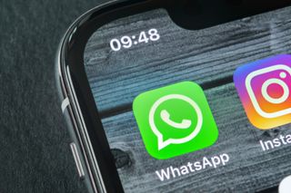 WhatsApp's app in the top corner of a smartphone 