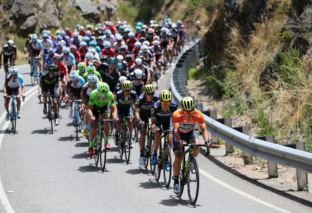 caleb Ewan takes a pull on front of the peloton leading into the final climb.