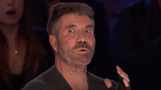 Simon Cowell listening to parmesan cheese song on America's Got Talent