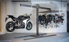 Suspended Honda Fireblade motorcycles side by side in the windows of London's Selfridges