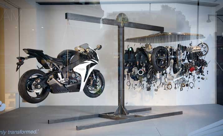 Suspended Honda Fireblade motorcycles side by side in the windows of London&#039;s Selfridges