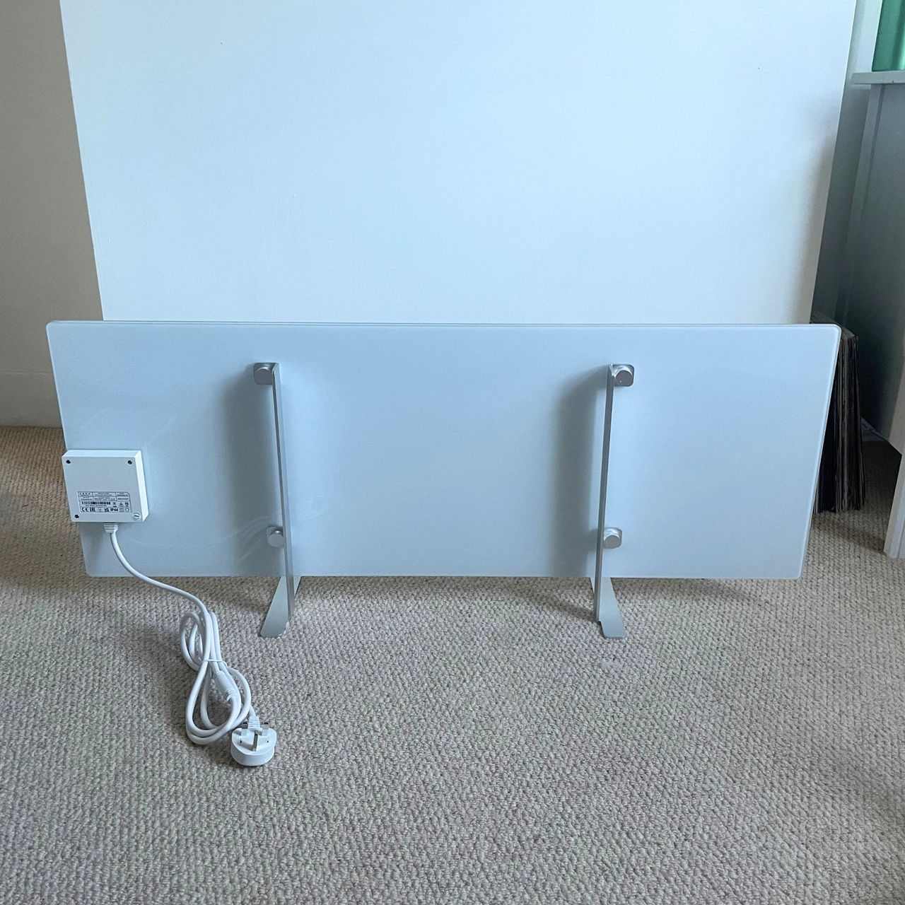 The back of the Aeno Premium Eco Smart Heater in front of a white painted wall