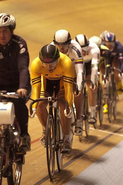 Malaysian rider Josiah Lam Onn Ng leads the field behind the derny during the men's keirin.