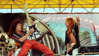 L-R Eddie Van Halen and David Lee Roth of Van Halen performs live at The Oakland Coliseum in 1977 in Oakland, California