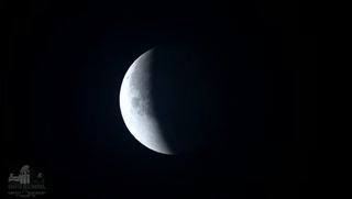 The Beaver Full Moon is seen partially obscured by Earth's shadow during the near-total partial lunar eclipse of Nov. 19, 2021 as seen through a telescope from the Griffith Observatory in Los Angeles, California.