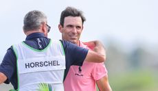Billy Horschel hugs his caddie after claiming victory