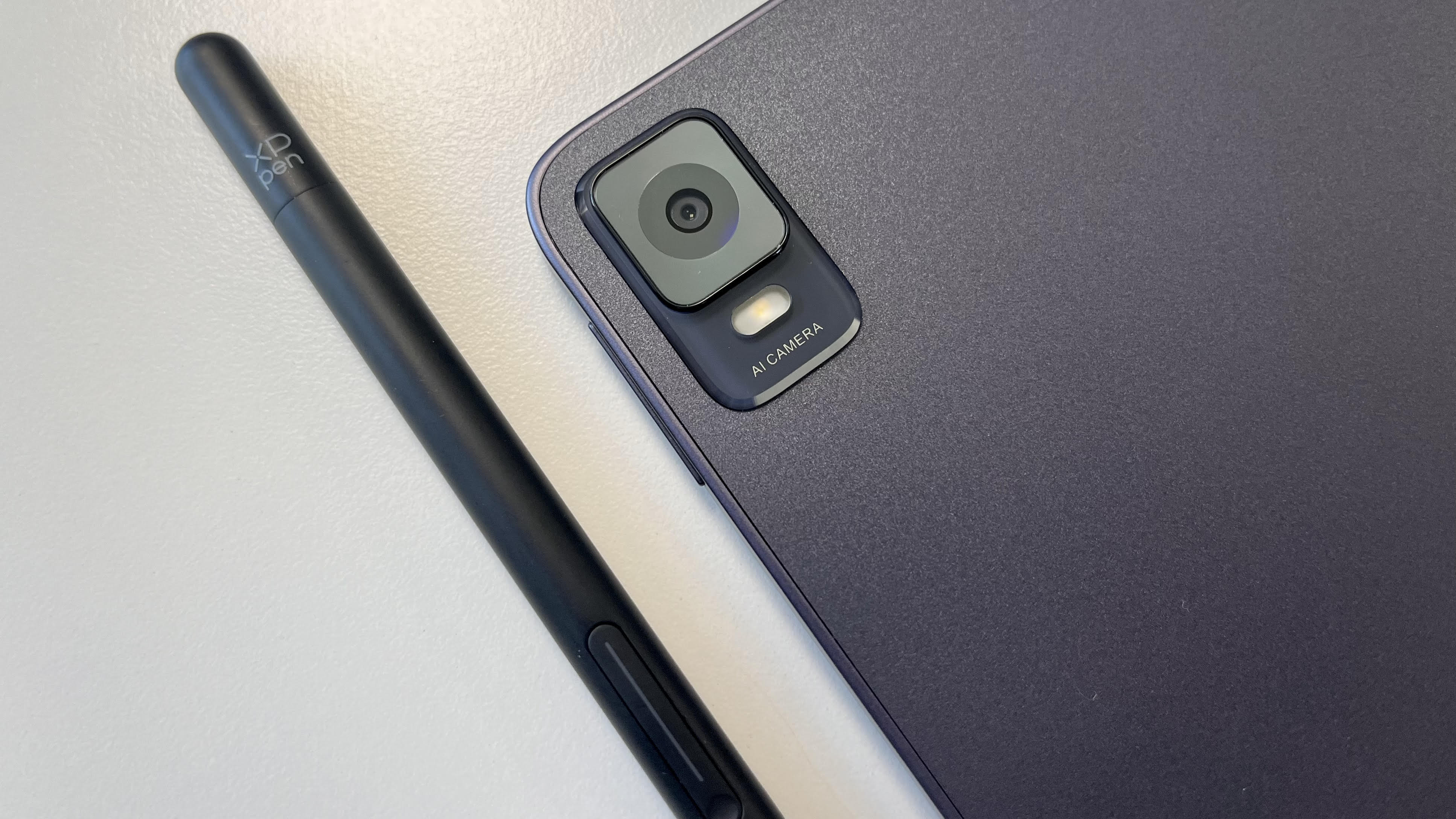 XP-Pen Magic Drawing Pad close-up image of the rear camera on a white background next to stylus