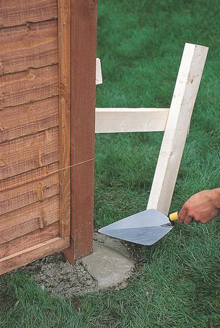 how to install fence panels: concrete in posts for fence panels