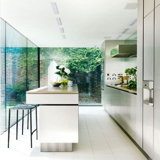 kitchen room with white ceiling and white limestone flooring