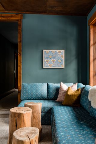 living room with teal painted wall