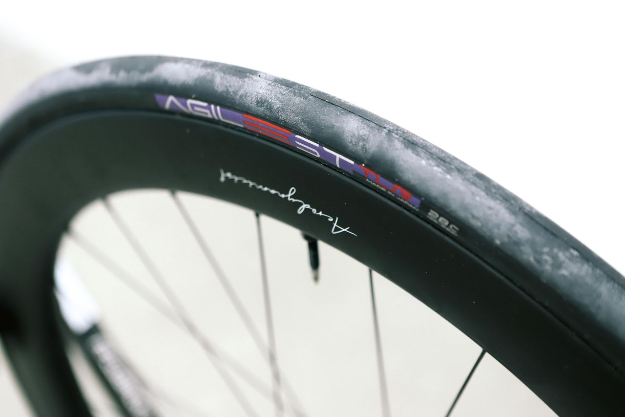 a close up of a black road bike tyre