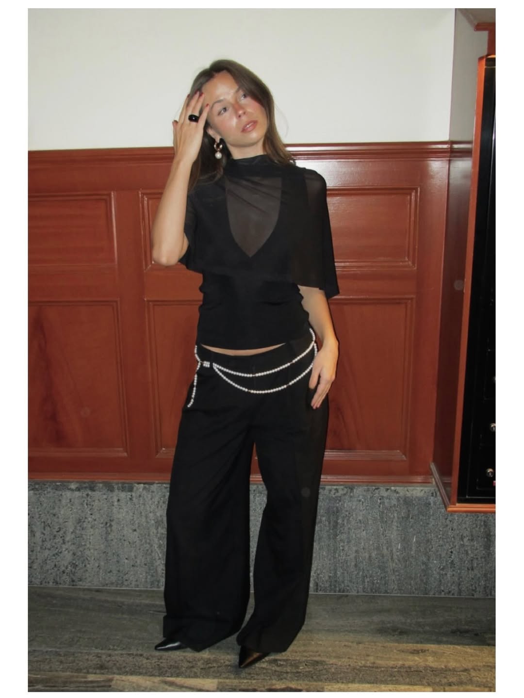 Influencer Johanna Lager wearing low-rise trousers and a sheer top.