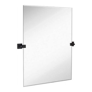 A rectangular mirror with two square metal brackets on either side