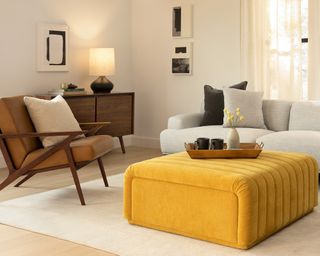 A bright yellow upholstered coffee table orro