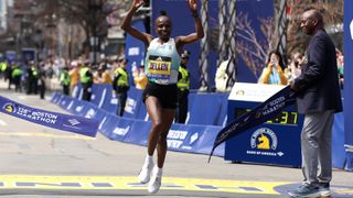 Hellen Obiri crosses the finish line first at the 128th Boston Marathon wearing On Cloudboom running shoes