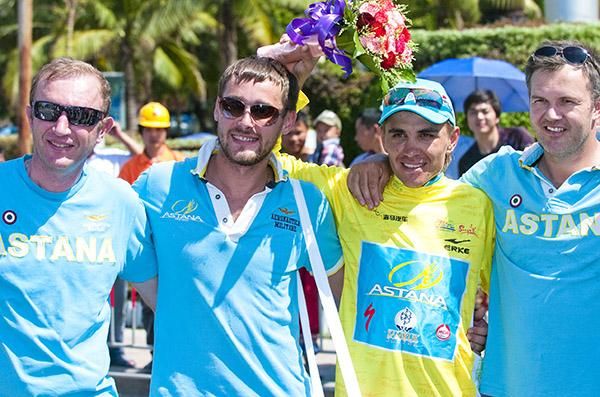 Tour winner Valentin Iglinskiy (yellow) with his Astana support staff and team-manager Alexandr Shefer (far left).