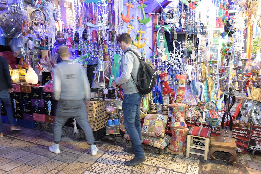 Riders shop in the bazaar at Akka.