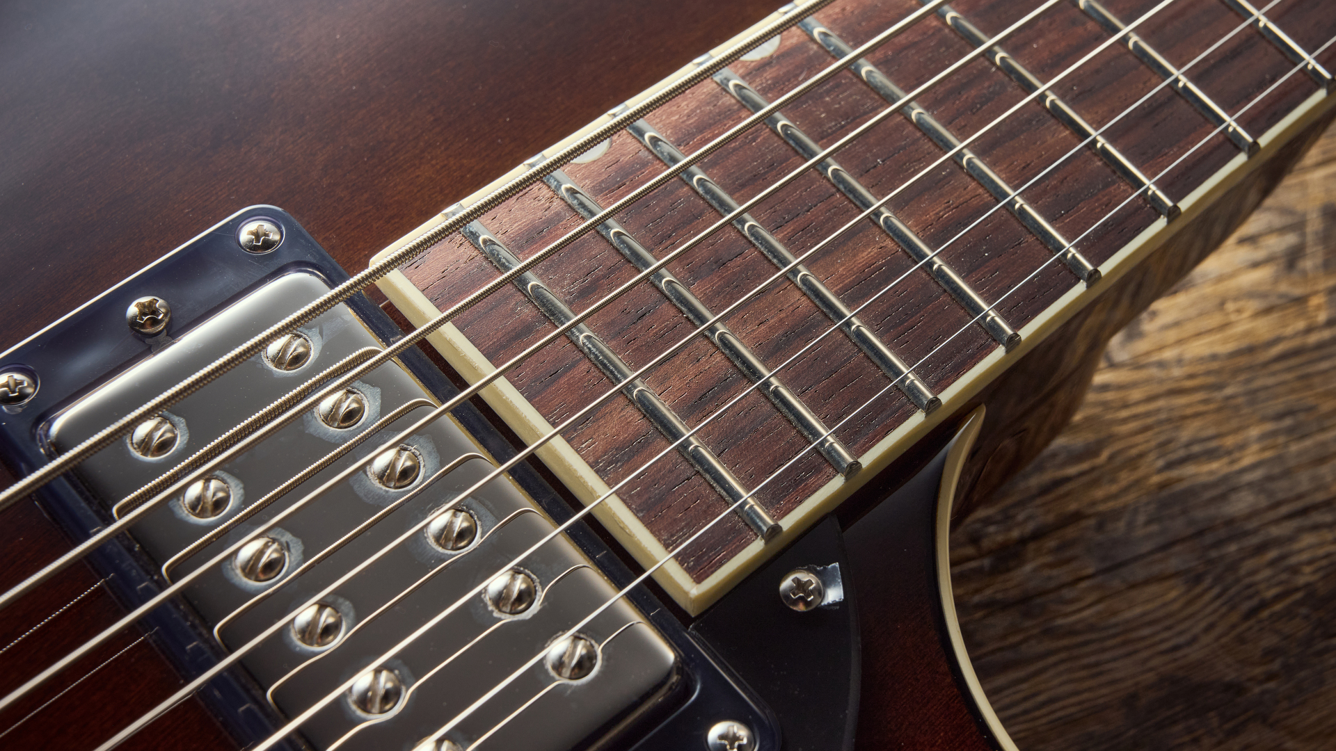 Close up of the neck humbucker and fretboard of the Gretsch Electromatic Jet Baritone guitar