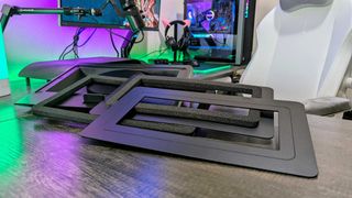 The Razer Laptop Cooling Pad on a desk with all three of its magnetic frames stacked on top.