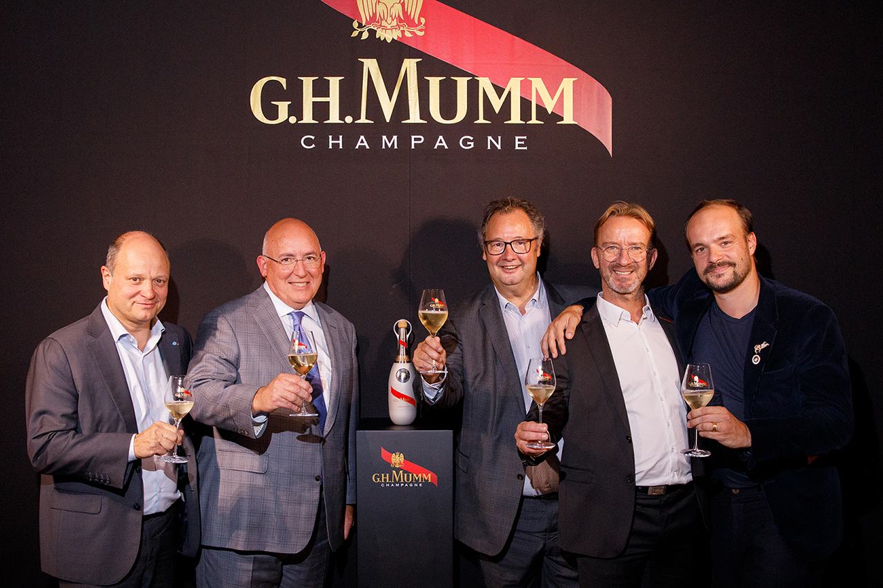 Maison Mumm and Axiom Space officials toast their partnership with Mumm Cordon Rouge Stellar champagne.